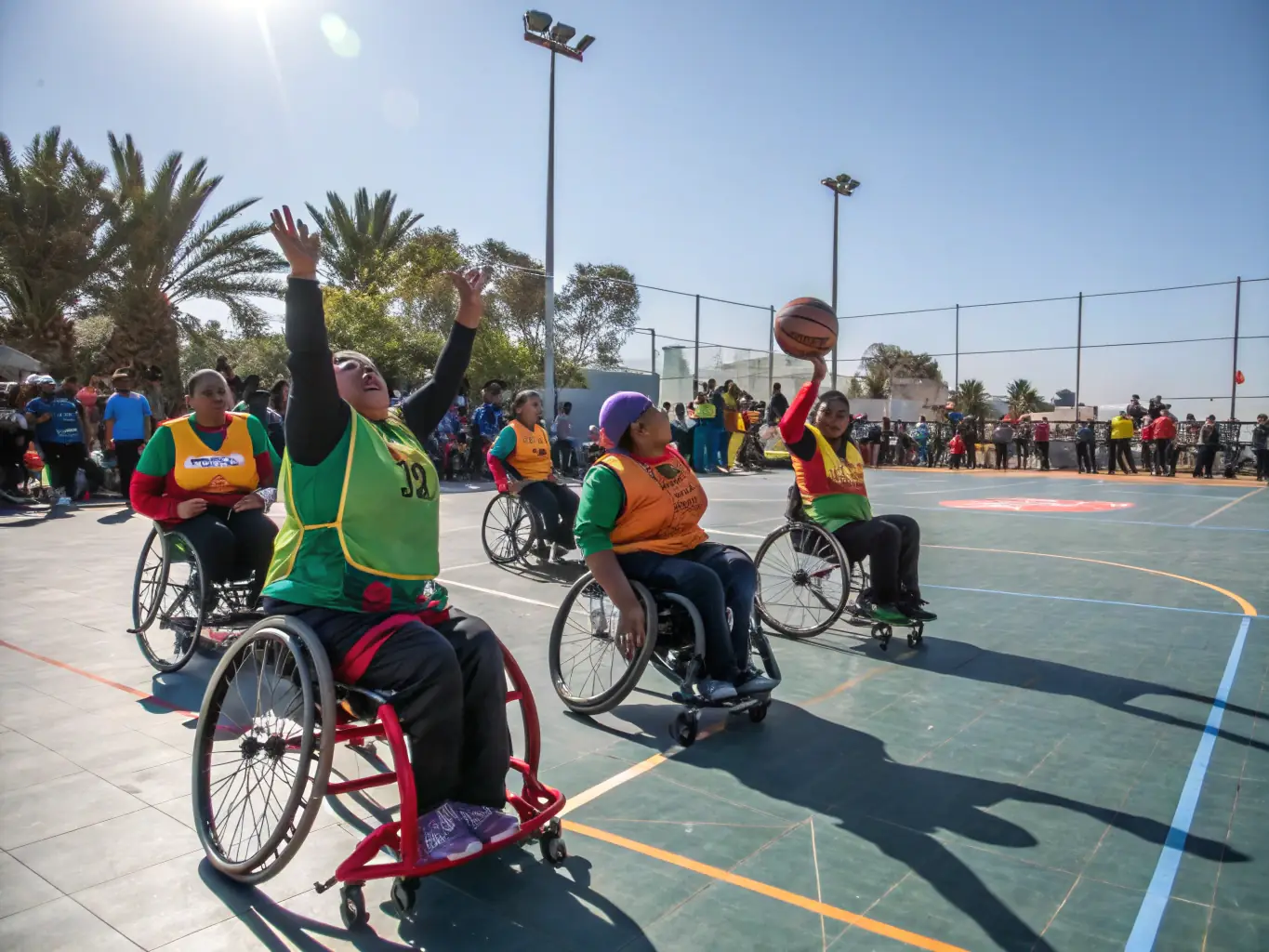 An inclusive image showing children and adults with disabilities participating in adapted tennis programs, highlighting the organization's commitment to accessibility.